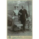 1906 - A full-length portrait photograph of a talented, elegant couple from the photography studio of Sándor Pottok. Budapest. Cabinet photo / hardback photo / business card. (2791877)