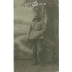   1915 - K.u.K. soldier in winter uniform with wand, full length, studio shot. Postcard, photo sheet. (2791892)