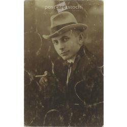   Elegant wealthy young man in hat with cigarette. Studio shot, photo sheet. 1920s, 1930s. (2791903)