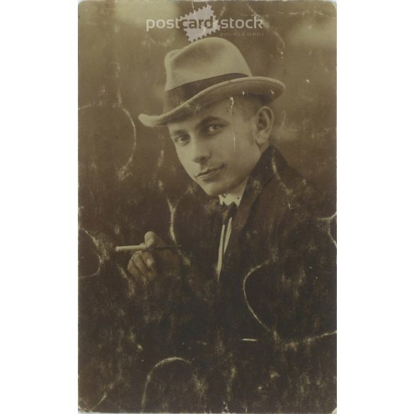 Elegant wealthy young man in hat with cigarette. Studio shot, photo sheet. 1920s, 1930s. (2791903)