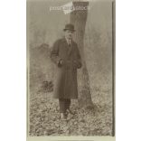 Photo of a full-length man from the 1920s in a hat and winter coat. Original paper image. Postcard, photo sheet. (2791909)
