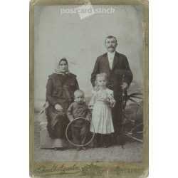   Photographic studio of Ágoston Schmidt, Budapest. Middle-class, full-family, studio photo of a family with two children. Cabinet photo / hardback photo / business card. (2791917)
