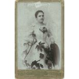 The work of painter and photographer Hawel Agoston, 1910s, Losoncz. Studio photo of young lady. Exciting composition combined with live flowers.  Cabinet card / CDV photo / hardback photo. (2791942)