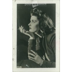   Studio profile portrait of Katalin Karády, Tibor Inkey, with cigarettes 1930s. Gelatin silver. (2791943)