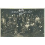 1926 - Group portrait outdoors of women, children and priests. Original paper image. (2791950)