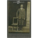 Full-length studio photo of a young man in a lower class.  Cabinet card / CDV photo / hardback photo. (2791955)