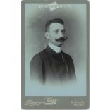 Cabinet photo taken in the photo studio of Décsei és Társa, Gyöngyös. Studio photo of a talented young man with a mustache and character.  Cabinet card / CDV photo / hardback photo. (2791956)