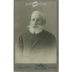   Cabinet photo taken in the photo studio of Fantó and Steiner, Gyöngyös. An artistic portrait photograph of an older man with his beard and mustache typical of the age.  Cabinet card / CDV photo / hardback photo. (2791958)