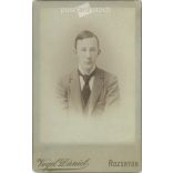 Cabinet photo taken in the photo studio of Dániel Vogel in Rožňava. Portrait photo of Karcsi Dragon.  Cabinet card / CDV photo / hardback photo. (2791959)