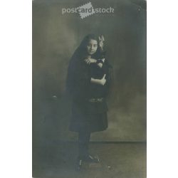   Full length photo of young girl with black kitten in studio. Original paper image. Postcard, photo sheet. (2791981)
