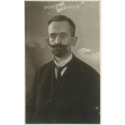   1935 - Portrait photo of a middle-aged man with a character’s mustache, studio shot. Original paper image. Postcard, photo sheet. (2791991)