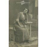 circa 1920 - Middle class young woman with flowers. Studio shot, photo sheet. (2791798)
