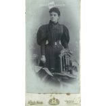 circa 1910 - Full-length cabinet photo taken in Károly Pobuda’s photography studio. Budapest. Talented young lady in bright elegant dress.  Cabinet card / CDV photo / hardback photo. (2792000)