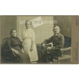 circa 1910 - Full-length family shot in the photography studio of Kozmann et al. Debrecen.  Cabinet card / CDV photo / hardback photo. (2792002)