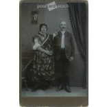Early 1900s. Photographer Lajos Madarász, Pécs. Full-length studio photo of an elderly couple.  Cabinet card / CDV photo / hardback photo. (2792107)