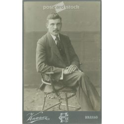   1908 - Knauer photography studio, Brasov. Full-length studio photo. Young man in elegant clothes sitting in a chair.  Cabinet card / CDV photo / hardback photo. (2792116)