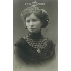   1920s. Photo of an elegant, young woman with fashionable hairstyles and neckties of the time. Original paper image. (2792159)