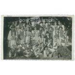 1946 - Group photo taken at a village party, with fun costumers and children. (2792165)