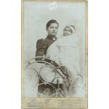 Early 1900s - Full-length studio photo of a young mother and her child. It was made by Leon H.’s photography studio in Budapest.  Cabinet card / CDV photo / hardback photo. (2792173)