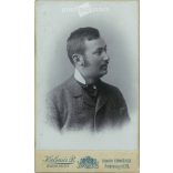 1899 - Studio portrait of a young man. Produced by Péter Kalmár’s photography studio in Budapest.  Cabinet card / CDV photo / hardback photo. (2792175)