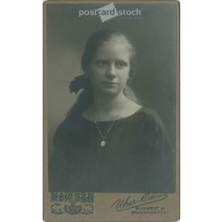   1922 - Studio portrait of a young woman. Produced by Ödön Uher’s photography studio in Budapest.  Cabinet card / CDV photo / hardback photo. (2792191)