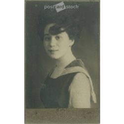   1920s - Studio portrait of a young woman. Its maker is unknown.  Cabinet card / CDV photo / hardback photo. (2792195)