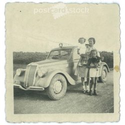   1930s. Mother with her daughters. Rest on the way. Original paper image. Its maker is unknown. (2792220)