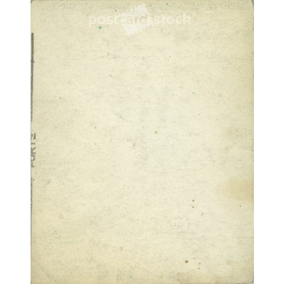 1930s. In the sunshine. Middle-aged couple in front of a haberdashery shop. Original paper image. Its maker is unknown. (2792221)