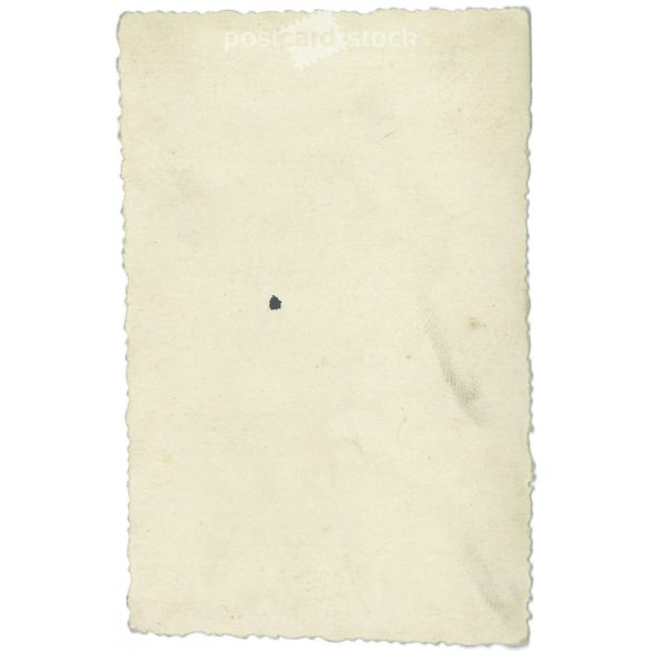 1930s. Unknown young girl in the courtyard. Winter shot. Original paper image. Its maker is unknown. (2792224)