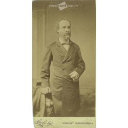   1890s. Man in jacket with cigar, studio shot. It was made by Sterlisky’s photography studio in Budapest. Original  Cabinet card / CDV photo / hardback photo. Cut. (2792230)