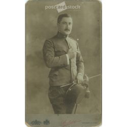   Early 1900s. Man in uniform with cigarette, studio shot. It was made by Sterlisky’s photography studio in Budapest. Original  Cabinet card / CDV photo / hardback photo. (2792237)