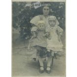 1910s. Young mother with her children, full length shot outdoors. Original paper image. Its maker is unknown. (2792249)