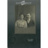 1910s. Young couple in elegant clothes, studio shot. It was taken in Gyula Franciscy’s photography studio in Körmöcbány. Original, cashiered paper image. (2792251)