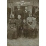 Early 1900s. Family group photo in the yard. The persons in the picture are unknown. It was taken in the photo studio of Illés Wucsetics in Budapest. Covered on hardboard. Cabinet photo / hardback photo / business card. (2792314)