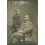 Early 1900s. Studio shot of father and son. Their identities are unknown. The photo. It was taken in the photographic studio of István Goszleth and his Son, in Budapest. Original  Cabinet card / CDV photo / hardback photo. (2792351)