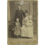 Late 1890s. Unknown young couple with their children, studio photo. The photo was taken in József Fodor’s photography studio in Nagy-Kanizsa. Original  Cabinet card / CDV photo / hardback photo. (2792353)