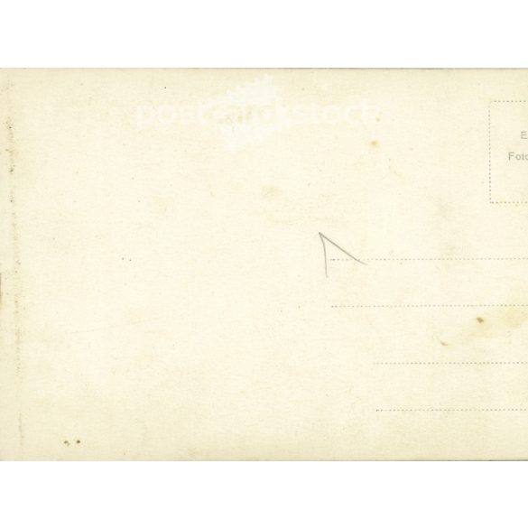 1930s. Elegant woman in a hat with a bag. Black and white old photo sheet, postcard. Cut. (2792368)