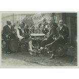 1930s. Cheerful, wine-drinking people. Black and white original paper image, old photo. (2792405)