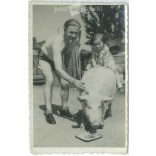 1930s. Riding the pig. Black and white original paper image, old photo. (2792407)