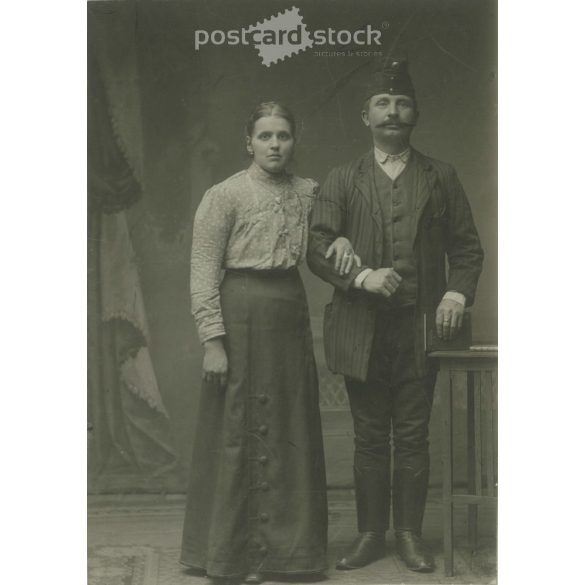Early 1900s. Railway couple. Black and white original cashier paper image, old photo. The picture was taken by Gizella Kulcsár, in Vác. (2792409)