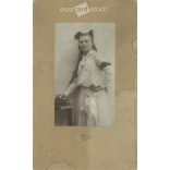 1905 - Girl with a bow, in white. Szombathely. Black and white original cashier paper image, old photo. The picture was taken by Tódor Szilárd’s photography studio. (2792412)