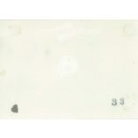 1930s. Germany. Car rest area. Young woman posing sitting on the bumper of the car. Its maker is unknown. Black and white original paper image, old photo. (2792430)