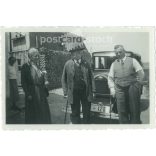 1950s. Germany. Family photo, elderly people standing in front of the car. The creator of the image is unknown. Black and white original paper image, old photo. (2792431)