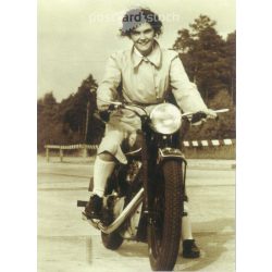   1950s. Germany. Young woman on a motorcycle. Published by Gutsch Verlag, Berlin. Cut out postcard. Black and white reprint from an old photo. (2792443)