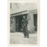 1964 - Young man in front of a cafe. Made by FOKI Foto photography studio. Black and white original paper image, old photo. (2792453)