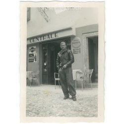   1964 – Young man in front of a cafe. Made by FOKI Foto photography studio. Black and white original paper image, old photo. (2792453)