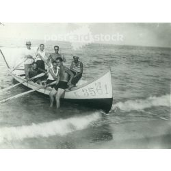   1932. Germany. Young men with a boat on the sea. The picture was taken by the Foto Regal studio. Black and white original paper image, old photo. (2792465)