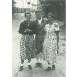 1950s. Germany. A young man in the company of ladies. The picture was taken by Foto-Seitz. Black and white original paper image, old photo. (2792491)