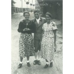   1950s. Germany. A young man in the company of ladies. The picture was taken by Foto-Seitz. Black and white original paper image, old photo. (2792491)