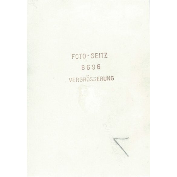 1950s. Germany. A young man in the company of ladies. The picture was taken by Foto-Seitz. Black and white original paper image, old photo. (2792491)